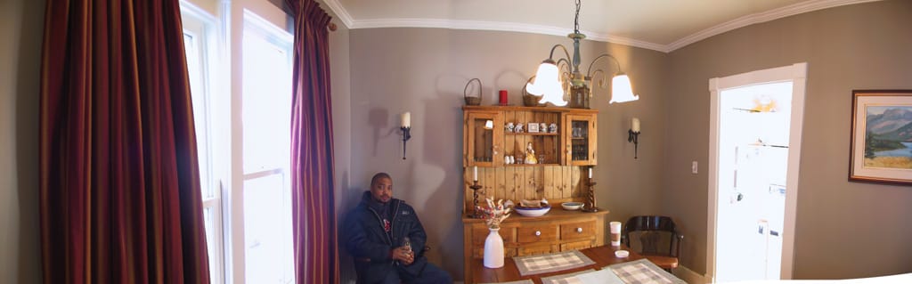 Chris sits in what will eventually be my dining room, Calgary, Alberta, 2 February 2002