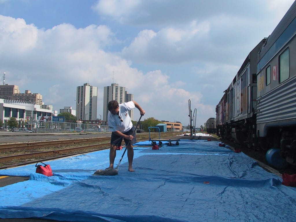 Bill swabs the tarps in London, Ontario, 21 September 2002