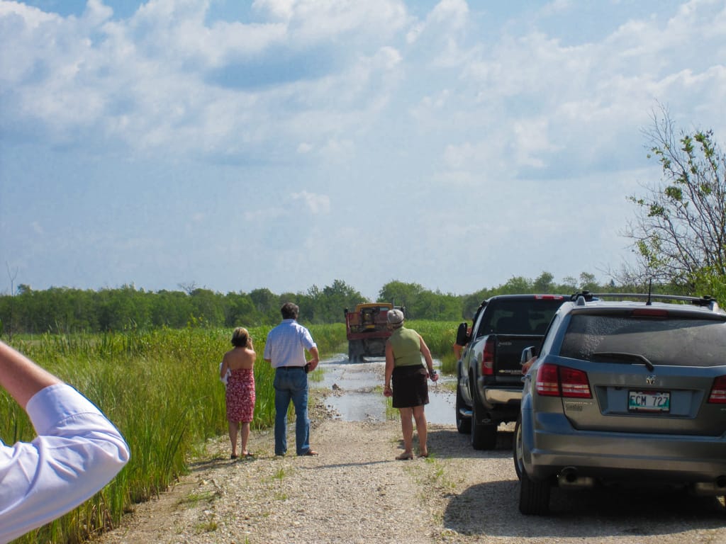 Checking water depth, Grahamdale, Manitoba, 7 August 2010